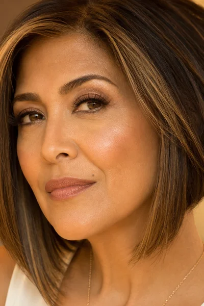 Angled bob with longer front pieces for women over 50 — modern cut that elongates the face