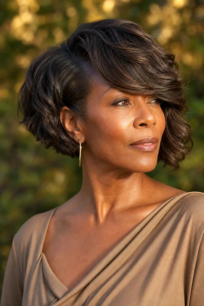 12 Flattering Short Haircuts With Bangs for Women Over 50 7 Woman with asymmetrical bob and long side fringe for longer face shapes
