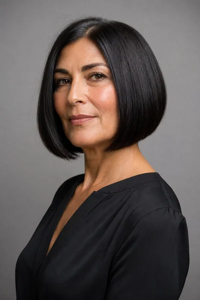 Blunt bob with clean outer line and hidden internal layers on thick hair