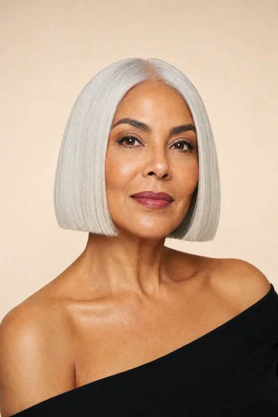 blunt gray bob haircut for women over 50 — one-length cut with sleek, polished finish