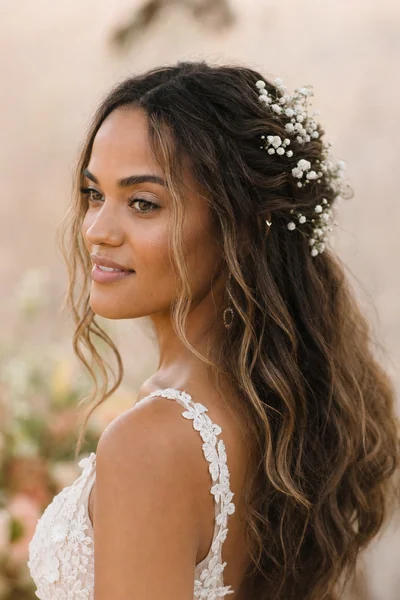 Bohemian half-up wedding hairstyle with baby's breath — relaxed bridal style for oval and square face shapes
