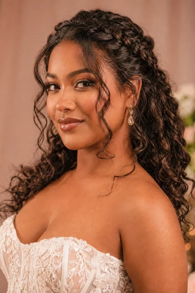 Braided crown half-up wedding hairstyle — romantic style for round and oval face shapes with thick curly hair
