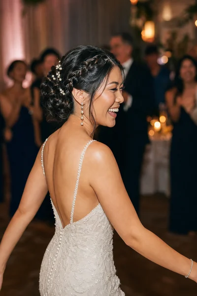 How to Choose Your Wedding Hairstyle Step by Step 7 Bride dancing at wedding reception with a secured braided updo holding perfectly through the evening