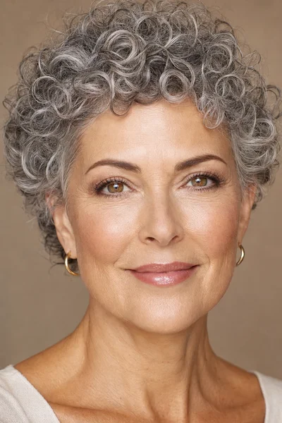 25 Short Curly Haircuts for Women Over 50 That Look Effortlessly Chic 25 classic curly pixie for oval face shape over 50 — short sides full crown