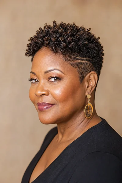 35 Short Haircuts for Black Women Over 50 That Look Stunning in 2026 33 Defined coil crop for Black women over 50 — tight 4c individual coils, short and low-maintenance, round face flattering