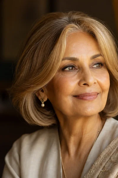 Gray bob with curtain bangs for women over 50 — center-parted bangs soften face on gray hair