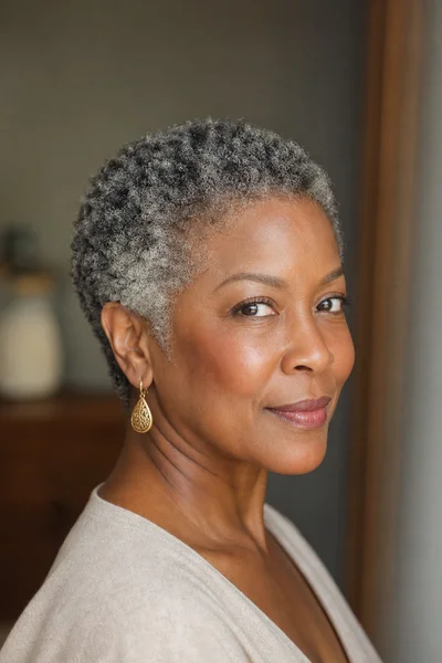 35 Short Haircuts for Black Women Over 50 That Look Stunning in 2026 30 Gray coily TWA for Black women over 50 — tight 4c coils, fully gray, shows color and texture beautifully