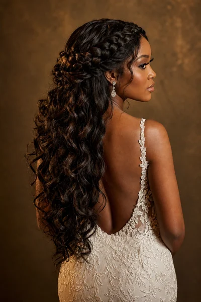 Halo braid half-up wedding hairstyle — showstopping bridal style for all face shapes with thick medium to long hair