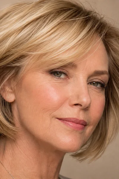 Layered bob with volume at the crown for fine hair over 50 — internal layers lift hair at the root
