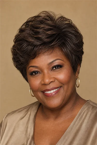 25 Flattering Short Haircuts for Women Over 50 Round Faces 26 Layered crop with crown lift — shape and volume for mature round-faced women over 50