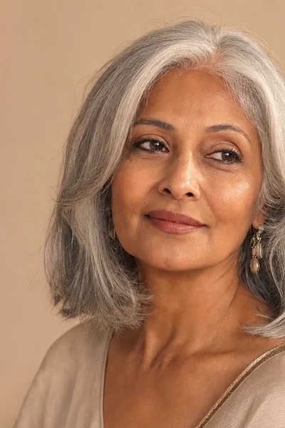 Long gray bob (lob) with face-framing layers for women over 50 — longer length with face-framing layers for movement and softness