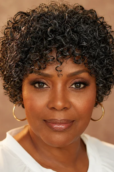 25 Short Curly Haircuts for Women Over 50 That Look Effortlessly Chic 27 curly micro bob with soft bangs for women over 50 — ear-length polished cut