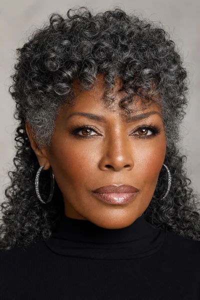 25 Short Curly Haircuts for Women Over 50 That Look Effortlessly Chic 23 curly mullet shag for women over 50 — shorter top layers with longer back