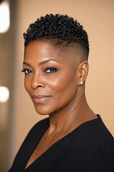 35 Short Haircuts for Black Women Over 50 That Look Stunning in 2026 12 Pixie cut with fade for Black women over 50 — crisp fade on sides and back, textured top