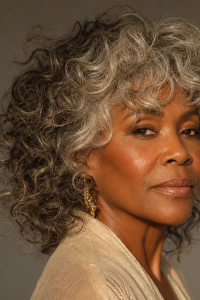 25 Short Curly Haircuts for Women Over 50 That Look Effortlessly Chic 17 curly shag with wispy face-framing bangs for women over 50 — textured layers