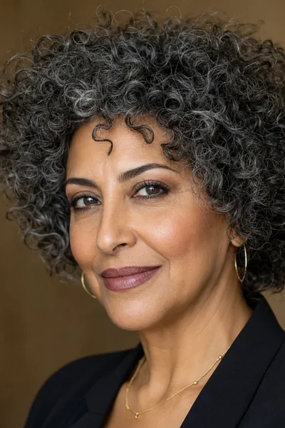 25 Short Curly Haircuts for Women Over 50 That Look Effortlessly Chic 8 short curly shag for women over 50 — thick curls with heavy internal layers