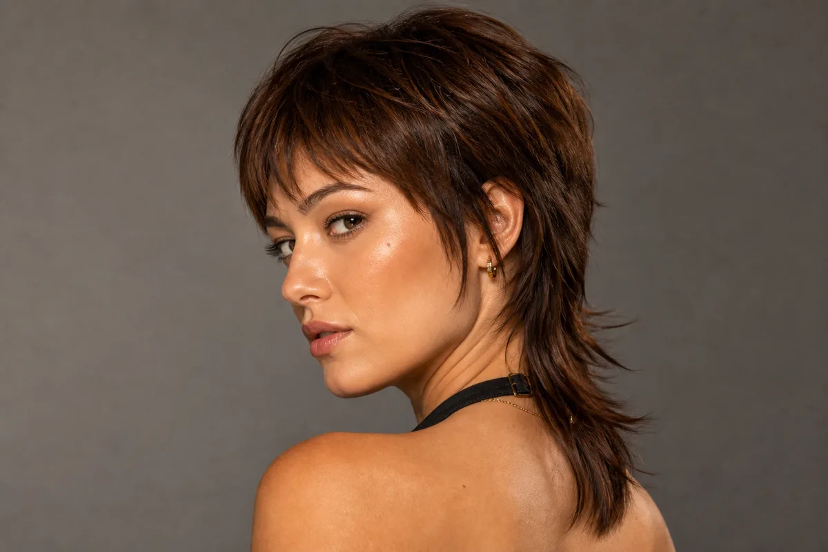 35 Edgy Short Haircuts for Women Ready for a Bold Change 27 Short mullet haircut with longer back — contrast short hairstyle on straight hair
