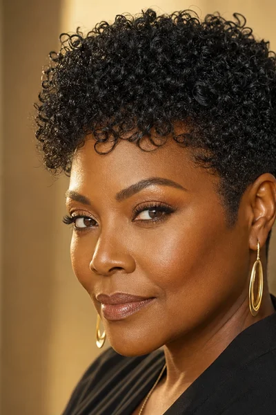 25 Short Curly Haircuts for Women Over 50 That Look Effortlessly Chic 14 tapered curly pixie for women over 50 — neat nape with full crown coils