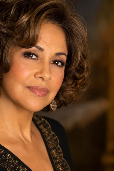 Voluminous layered bob with soft curls for fine hair over 50 — curls add significant visual volume and shape