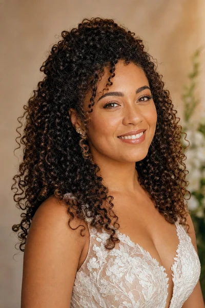 Voluminous curly half-up wedding hairstyle — beautiful bridal style for curly hair brides with round and oval faces