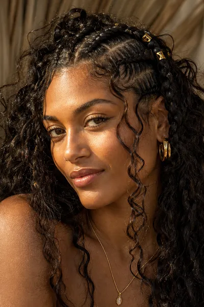 20 Goddess Braids That Make a Statement 19 boho goddess braids with loose curly face-framing pieces at hairline and temples