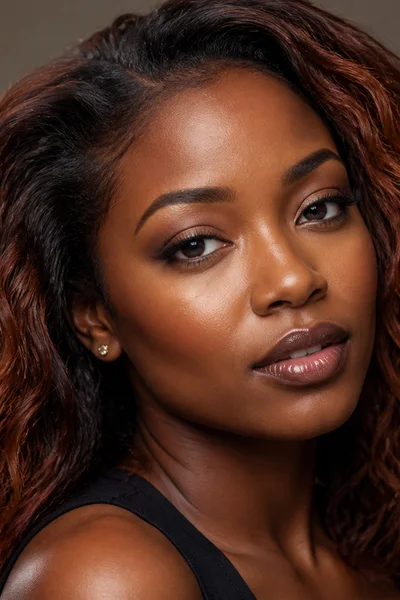 Cinnamon spice hair color on coarse textured hair — warm autumn tone