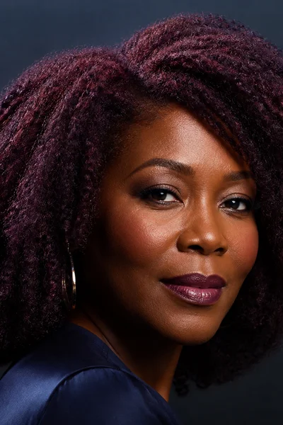 Cool mahogany red-brown with purple undertones on coarse hair — sophisticated cool-toned shade