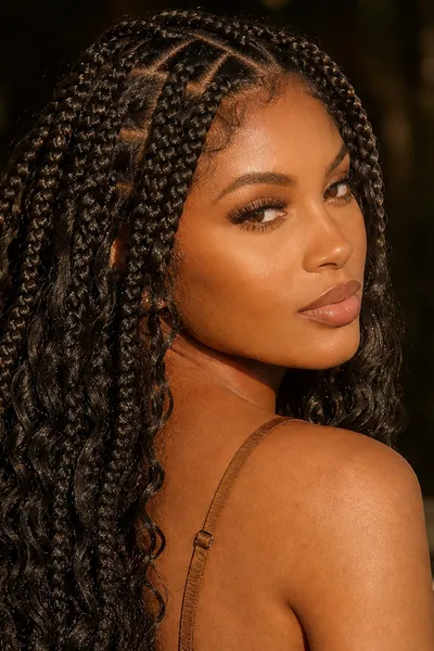 20 Goddess Braids That Make a Statement 11 goddess box braids with individually parted square sections and curly synthetic ends