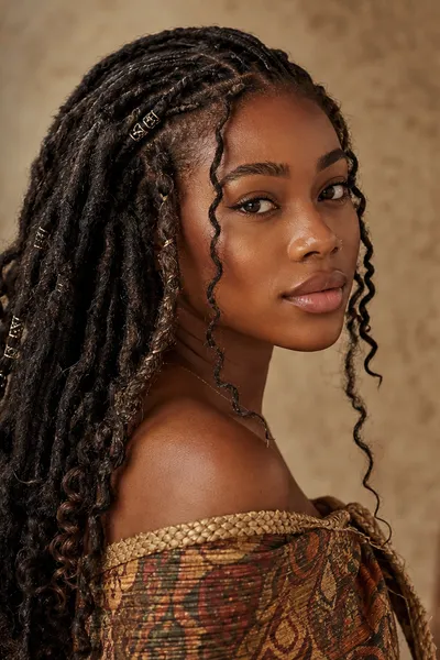 20 Goddess Braids That Make a Statement 13 goddess locs with textured faux loc wraps over cornrow base and curly loose ends