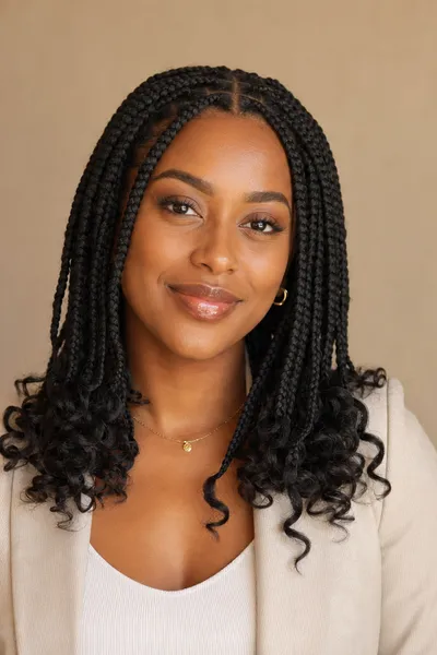 20 Goddess Braids That Make a Statement 6 medium-sized goddess braids with grid parting and collarbone-length curly ends, styled for everyday wear