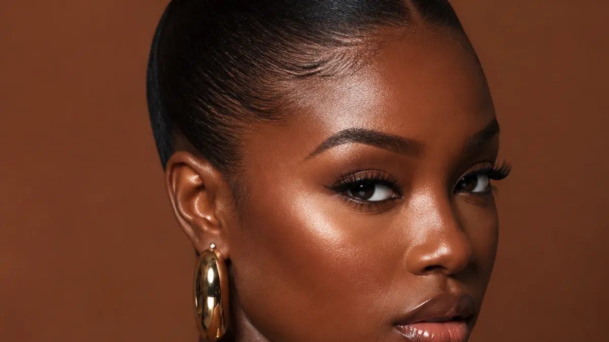 Bold prom updos: sculptural high bun with metallic cuff — statement-making hairstyle for dramatic formal looks
