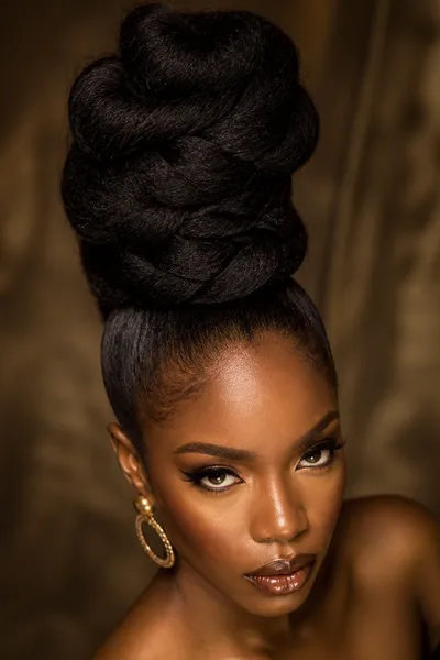 Gravity-defying vertical bun — most dramatic prom updo with architectural vertical lift