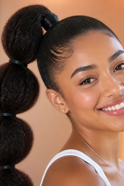 Voluminous bubble ponytail — playful, structured prom updo with three sections of fullness