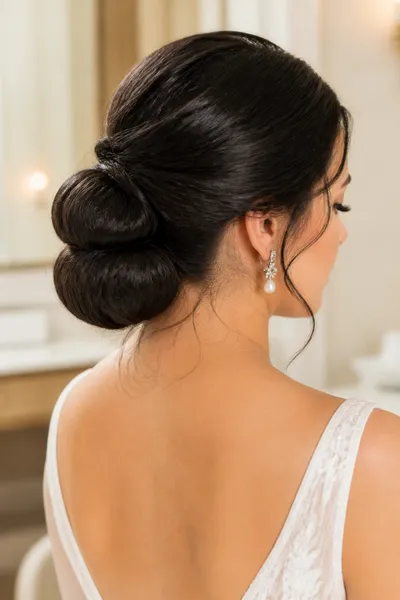 12 Bubble Bun Hairstyles That Are Trending This Year 12 Bridal bubble bun at nape with soft baby hairs, romantic long-hair wedding updo.