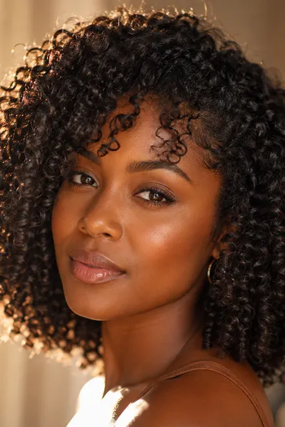 curly lob haircut with defined curls at collarbone length