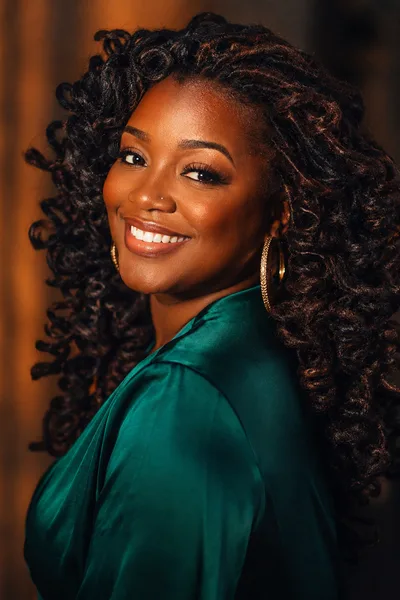 Curly loc hairstyle with barrel curls, romantic bouncy styling for date night
