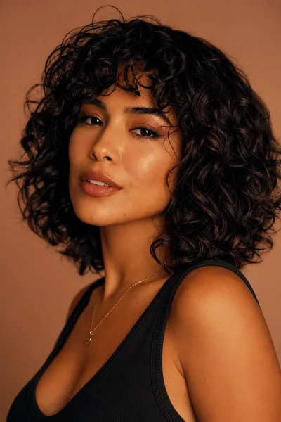 Curly Shag haircut flattering a heart-shaped face