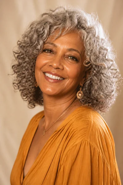 30 Flattering Hairstyles for Women Over 60 You Will Love 20 Curly shoulder-length cut for women over 60 — textured natural gray curly style with layers