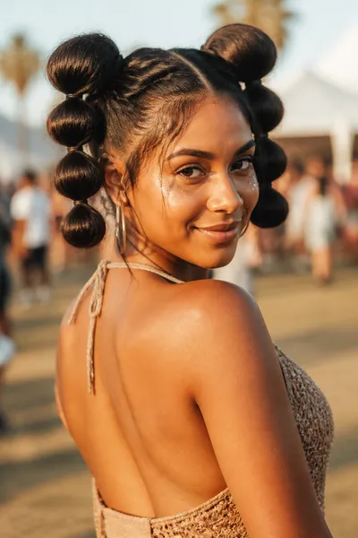 12 Bubble Bun Hairstyles That Are Trending This Year 6 Double bubble buns on each side of head, playful festival-ready hairstyle.