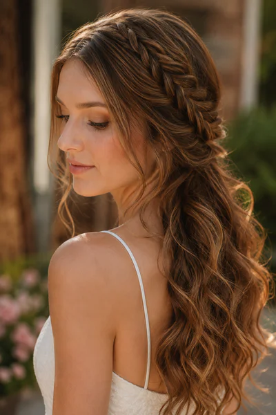 Fishtail braid with loose waves, one of these homecoming hair ideas for long hair