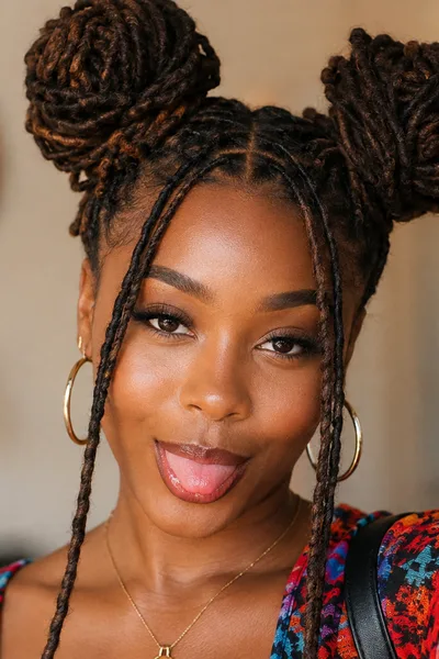 Loc space buns hairstyle, playful two-bun style for casual dates and fun occasions