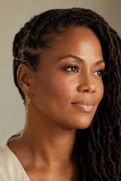 Side-swept loc hairstyle for all face shapes, mature locs styled to one shoulder