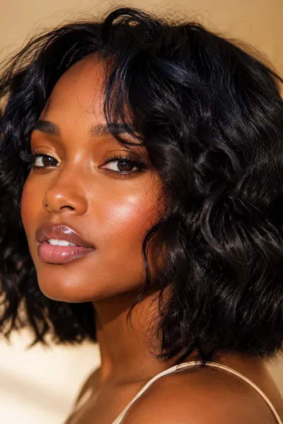 textured layered lob haircut with soft piecey ends for round faces