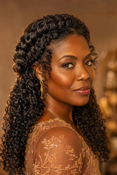 Twisted crown braid on curly hair, one of these homecoming hair ideas for curly and textured hair